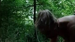 Boldly chaining and humiliating French milf slave in forest with dildo and slapping