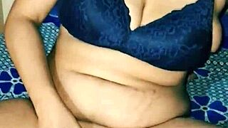 Desi hot Indian housewife with big boobs and hairy pussy inserts dildo while moaning wetly.