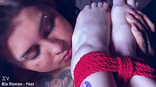 playful rotten venus tickles bound bia's perfect feet.
