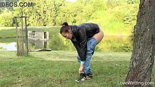 Susie enjoys a relaxing outdoor pissing scene in public.
