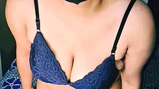 Desi hot Indian housewife with big boobs and hairy pussy inserts dildo while moaning wetly.