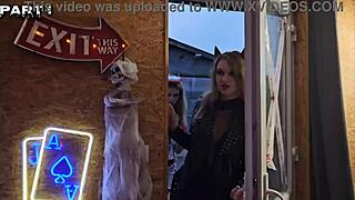 Five girls in costumes lick pussies and strap-on fuck asses at Halloween party with Alice Maze and Irogenia.