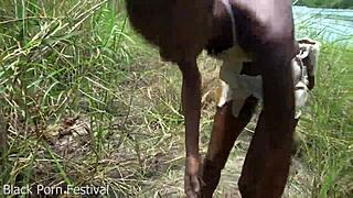 skinny african tribe woman with narrow ass works outdoor in ebony setting