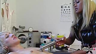 Watch Dylan Ryder get dildo fucked on the medical table by nurse Maxine X!