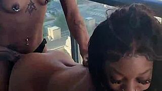 kashofficials bends over on the balcony getting strapped doggystyle by renity love with ebony lesbian strapon action and tight pussy riding in public