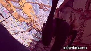 I love how Lucy slowly takes off her bikini in the pool teasing with her hairy body during solo underwater bathing