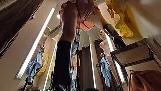 Look at this hot blonde trying on see-through clothes without panties in the dressing room on hidden camera. She's so wet and exposed!