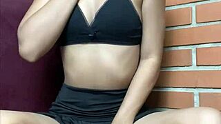 Petite single girl indulges in solo play using a massive black dildo to satisfy her tight pussy desires.