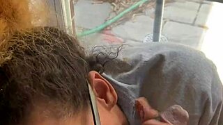 In a homemade setup, lightskin ebony slut gives blowjob to big black cock friend by the window and takes facial cumshot.