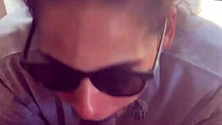 In a homemade setup, lightskin ebony slut gives blowjob to big black cock friend by the window and takes facial cumshot.