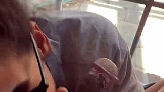 In a homemade setup, lightskin ebony slut gives blowjob to big black cock friend by the window and takes facial cumshot.