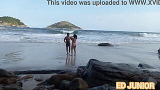 Asian Babe with Big Ass Gives Blowjob to Big Cock in Outdoor Nudist Beach Scene