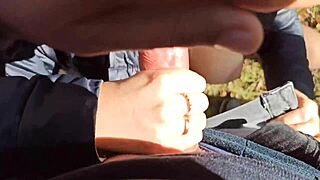 Hey, watch this public blowjob turn into fingering with cum splashing on her big tits outdoors