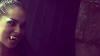 two sexy lesbian vampires dressed in costumes kiss passionately then fuck each other with huge dildo reaching intense orgasms