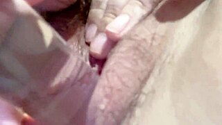 Woman uses long glass dildo for solo play in homemade video