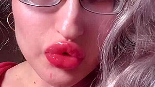 I worship bimbo girl with red lips and lipgloss in webcam domination session
