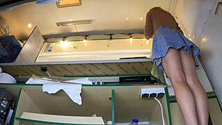 the amateur blonde reveals her shaved pussy when panties move aside under skirt outdoors