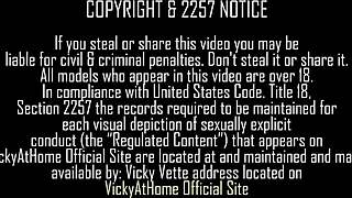 Vicky Vette lies on the bed in white lace fingering her big clit and shaved pussy lips.