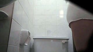 Why is this Colombian milf peeing on hidden cam in public outdoor spot?