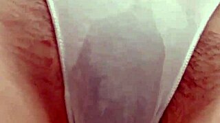 This pissing girl desperately needs to go so she undresses and pees in the bath through her panties then squeezes them out.