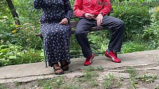 Hot MILF Jerks Off Huge Dick into Glass on Park Bench