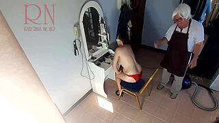Look at this hidden camera catching the lady undressing in the nude barbershop.