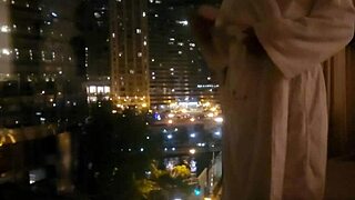 Petite amateur babe masturbating clit close up in public outdoor spot in front of hotel window to orgasm