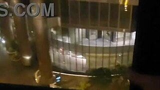 Petite amateur babe masturbating clit close up in public outdoor spot in front of hotel window to orgasm