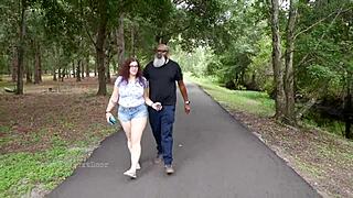 This nerdy milf was out in the park, casually stroking and sucking on a black dick.