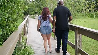 This nerdy milf was out in the park, casually stroking and sucking on a black dick.