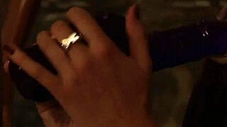 Sensual naked lesbian slave receives strapon as a gift from madame in bondage domination scene.