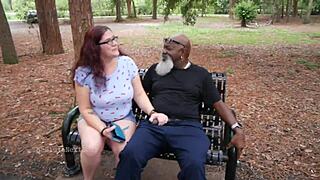 This nerdy milf was out in the park, casually stroking and sucking on a black dick.
