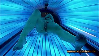Wow, check out this beautiful woman masturbating wildly on the solarium cam!