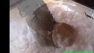 What a naughty brunette flashing her natural tits in the public bar! She's all naked in the outdoor bathtub, so wild!