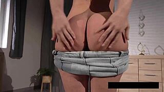 piss-spitting brunette plays with her puffy pussy lips up close