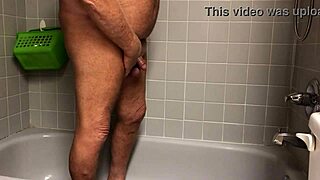 woman warms up in shower with vibrator toy