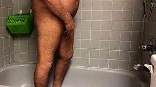 woman warms up in shower with vibrator toy