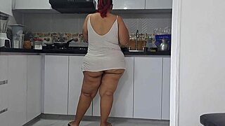 In the kitchen, he grips his throbbing cock watching his chubby stepmom's massive ass sway seductively