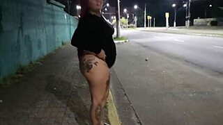 Sabrina Strong's giant tattooed Brazilian ass flashes traffic in bold public outdoor tease, stopping cars cold.